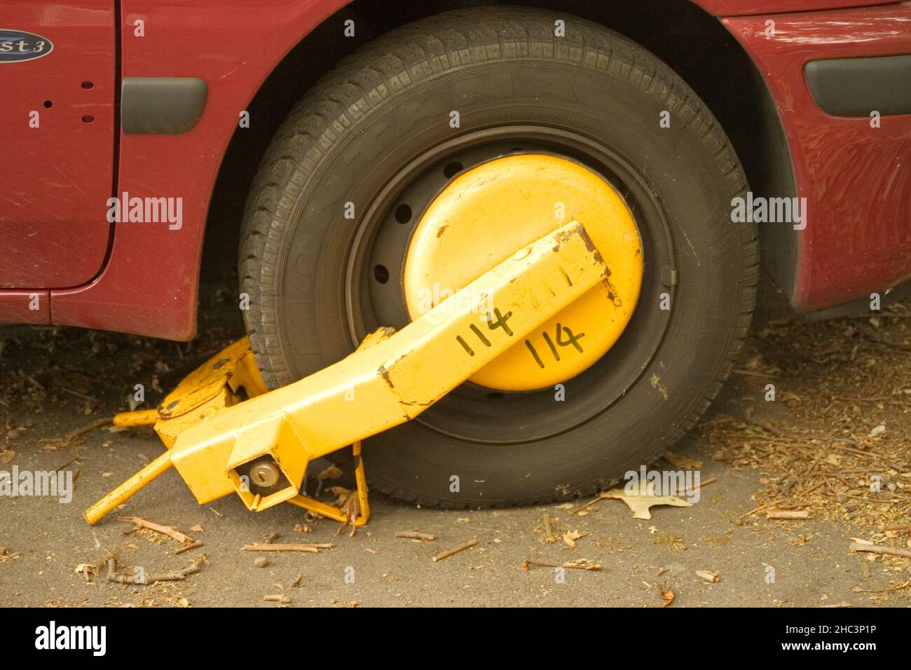 Locked wheel of a car parked in an improper place Stock Photo Alamy