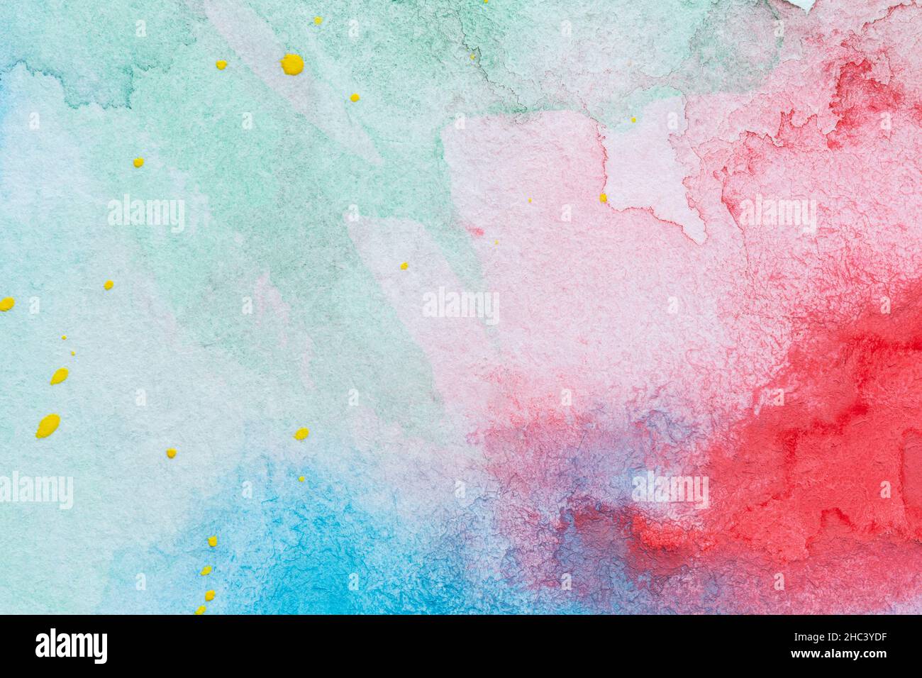 Macro close-up of an abstract colorful watercolor gradient fill background with watercolour stains & drops. full frame textured white paper background Stock Photo