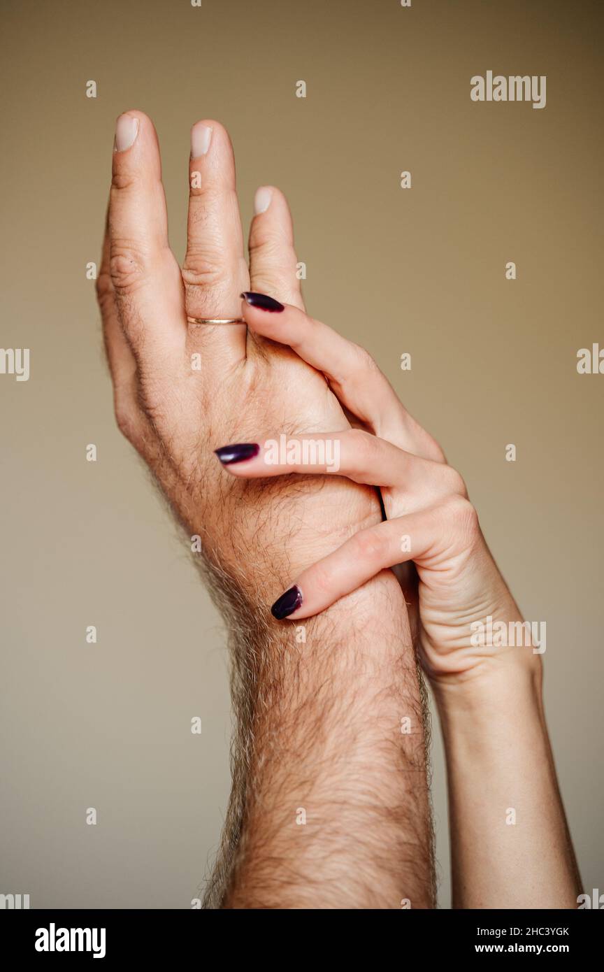 gentle touches of the hands of a man and a woman, intimacy between ...
