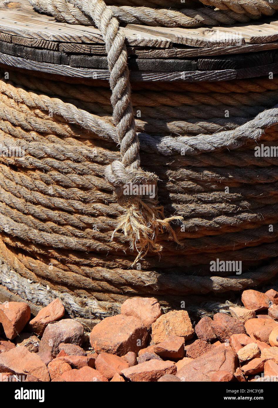 Vertical shot of interwoven wool ropes Stock Photo