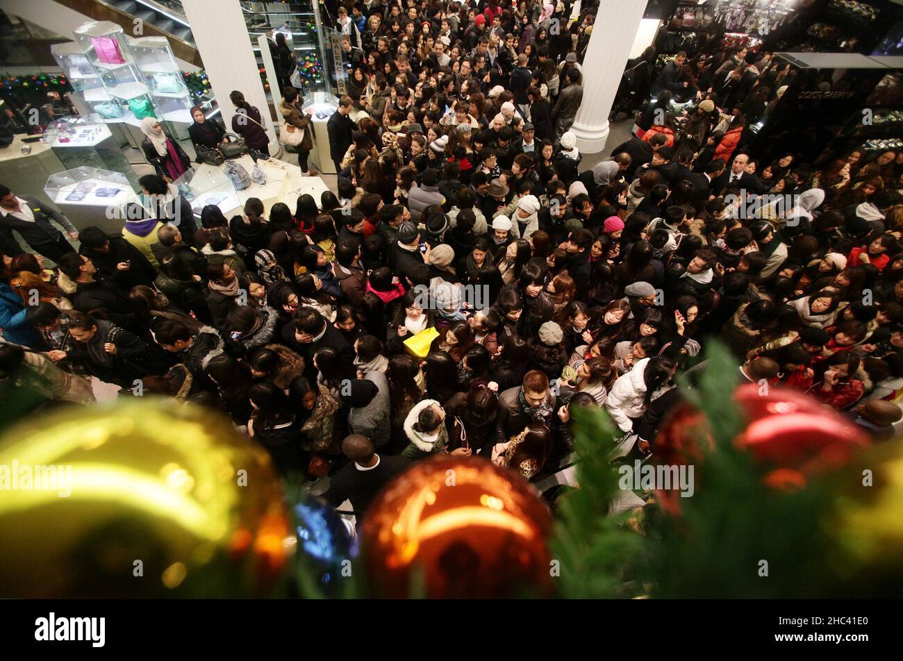 File photo dated 26/12/2010 of shoppers at the Selfridges Boxing Day sale on Oxford Street, central London. The Weston family has sold the luxury retail group Selfridges, founded in 1908 by Harry Gordon Selfridge, to retailer Signa Holding and property company Central Group. Issue date: Friday December 24, 2021. Stock Photo