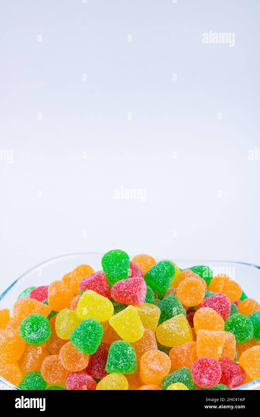 Gummy candies. Gummy candies in the bowl isolated on white background