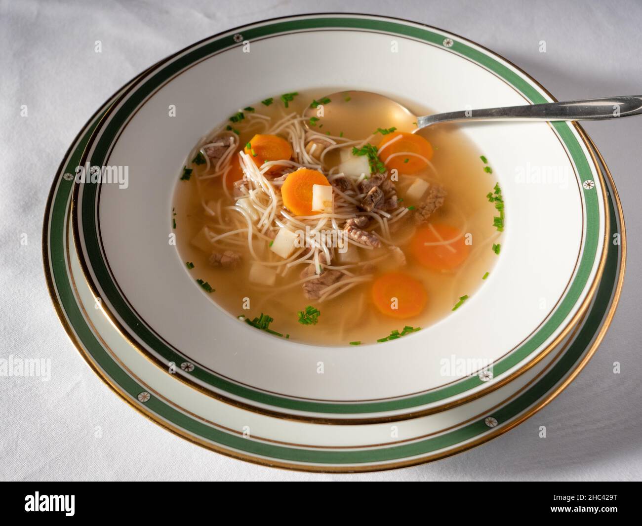 Altwiener Suppentopf or Old Vienna Style Soup Pot with boiled Beef, Noodles and Carrots Stock Photo