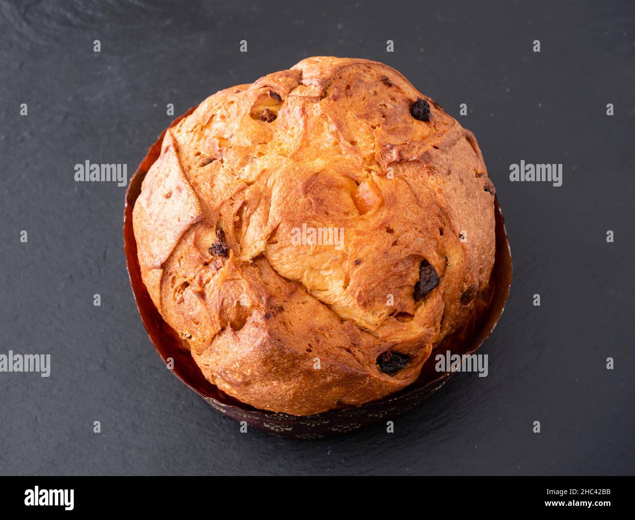 Whole Panettone Italian Sponge Cake or Sweet Bread from Milan, Served Traditionally for Christmas Stock Photo