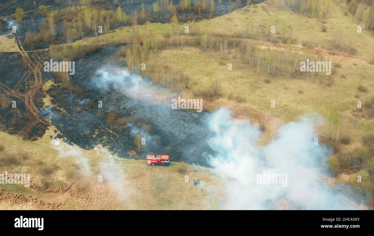 4K Aerial View Spring Dry Grass Burns During Drought Hot Weather. Bush ...