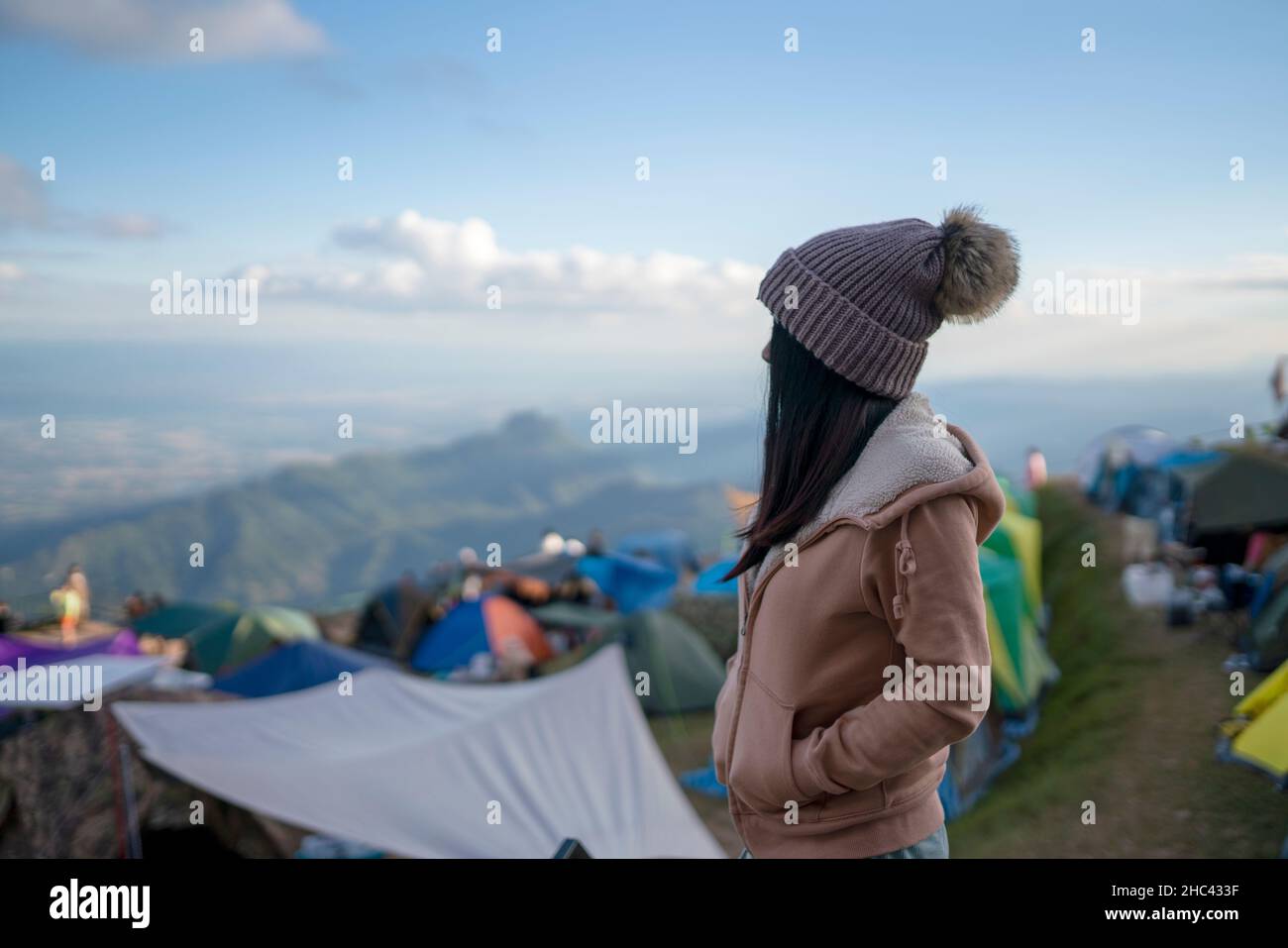 young woman on holiday freedom standing on the mountain Phu Thap Boek Phetchabun, Thailand. Stock Photo