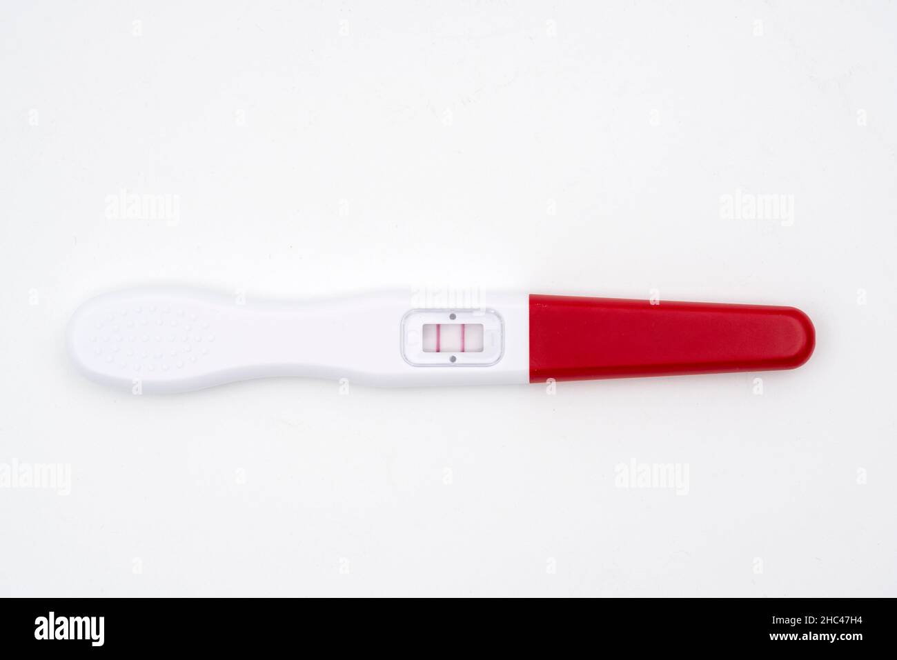 Positive pregnancy test cut out isolated on white background Stock