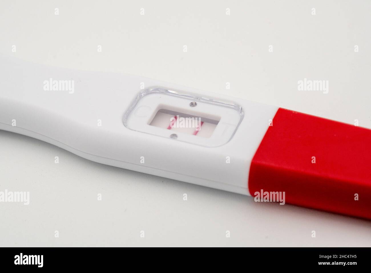 Positive pregnancy test close up on white background Stock Photo