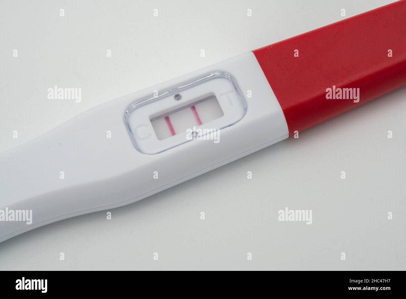 Positive pregnancy test close up on white background Stock Photo