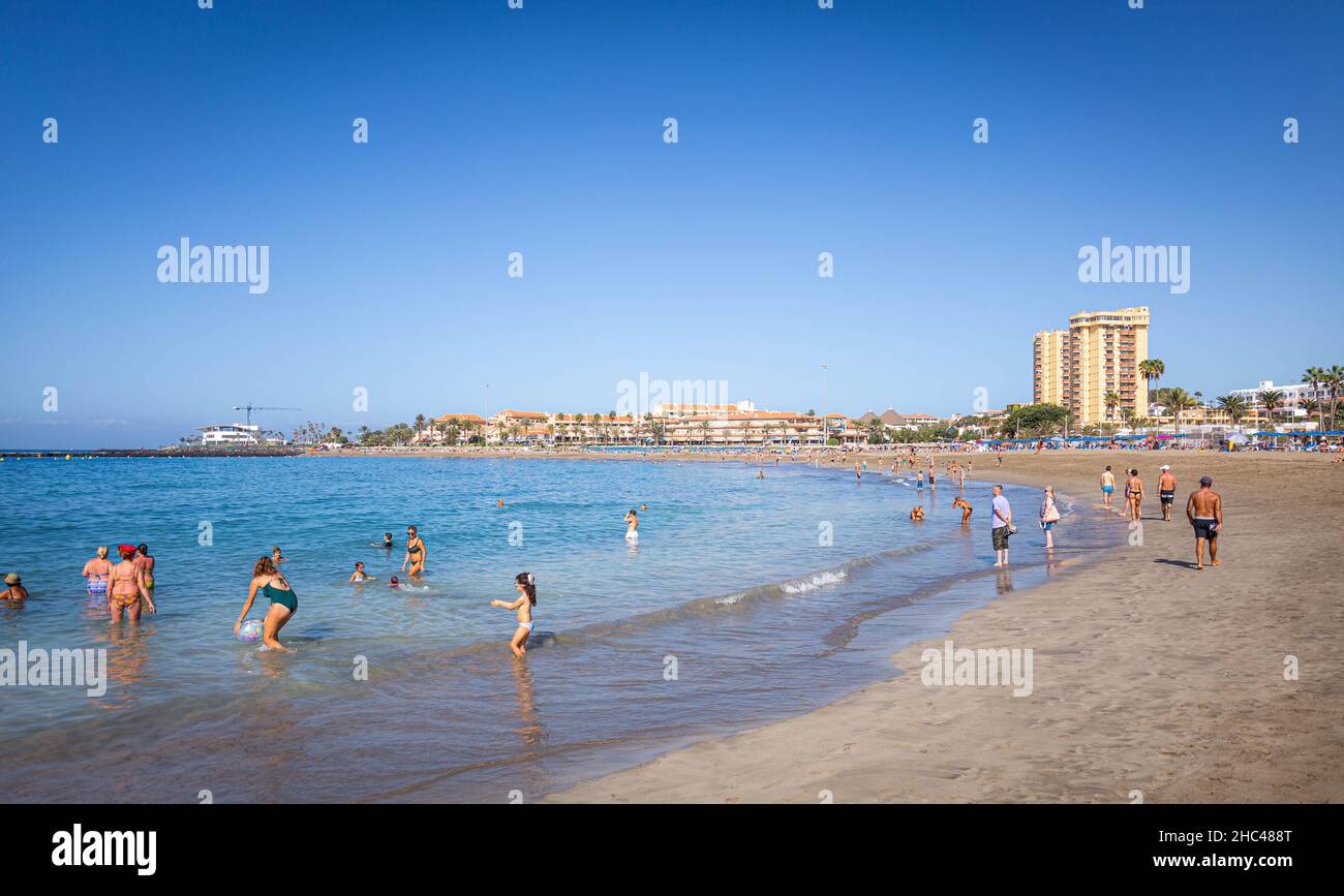 Costa Adeje beach with people on a sunny day, Tenerife Stock Photo