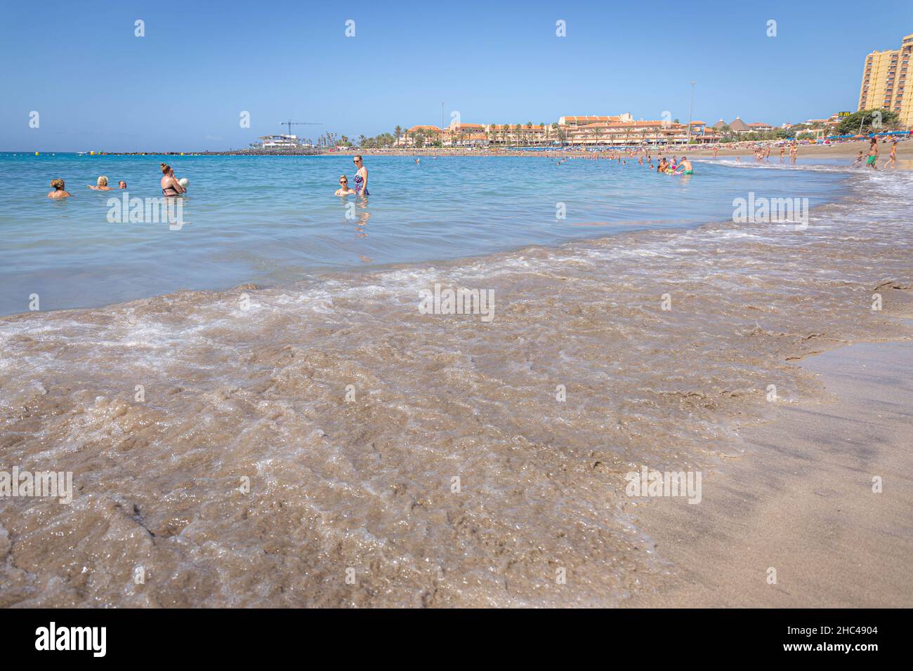 Costa Adeje beach with people on a sunny day, Tenerife Stock Photo