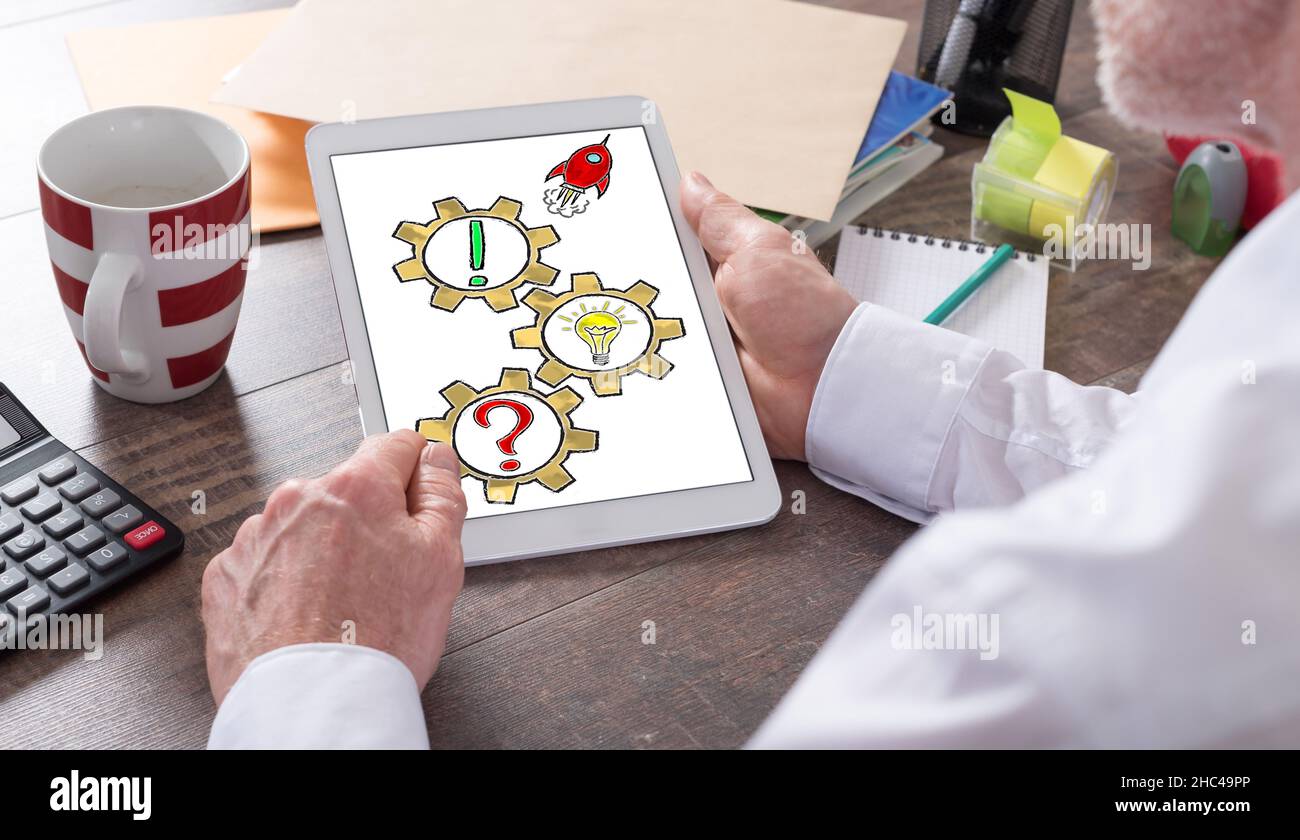 Problem solving concept shown on a tablet held by a man Stock Photo