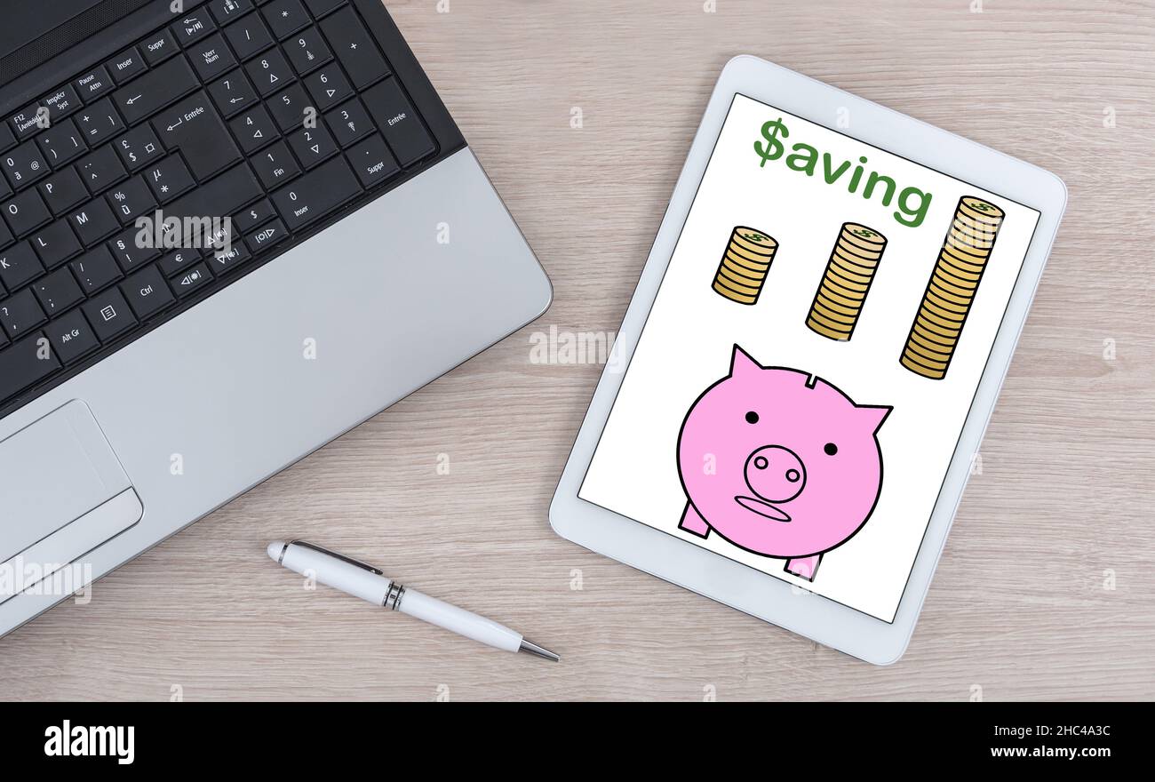Saving concept shown on a digital tablet Stock Photo