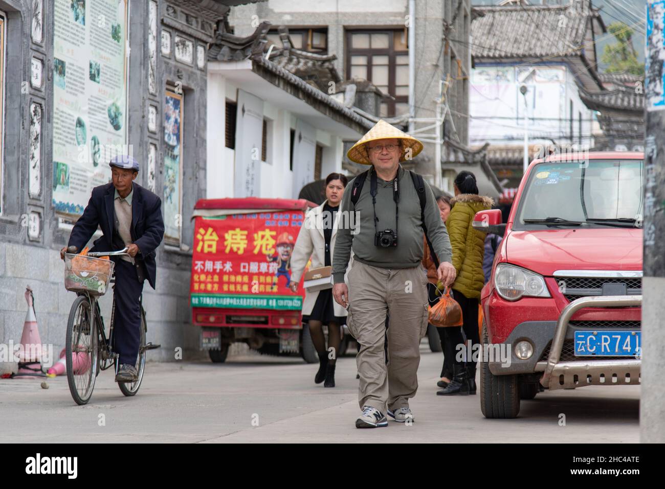 February 2019. Bai village of Zoucheng, which produces batik. Residents and tourists stroll through the streets of the market Stock Photo