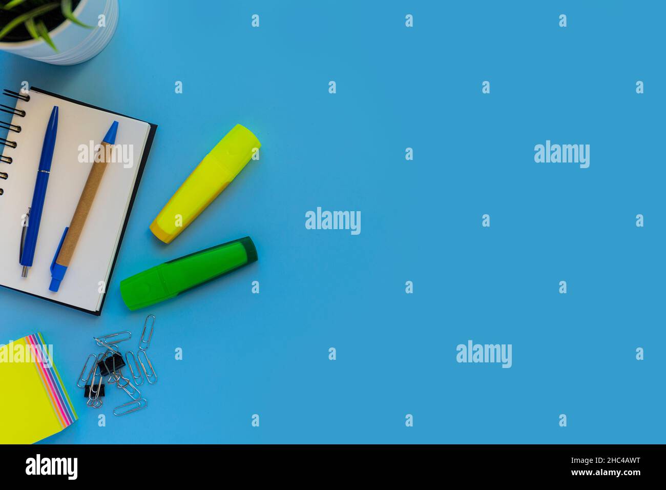 Flat lay workspace, copy space, blue background, top view office desk Stock Photo