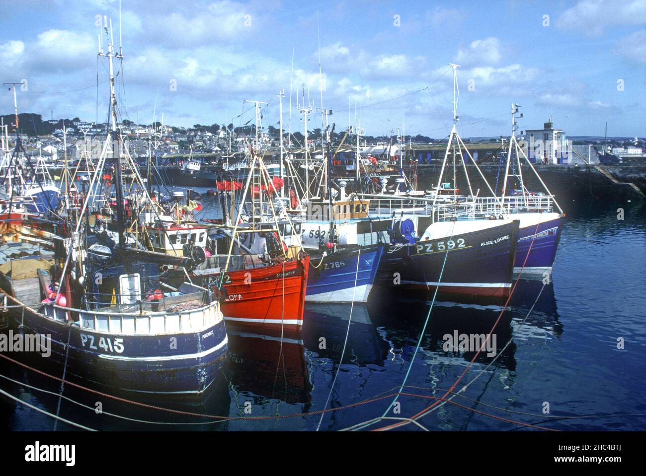 Line of trawlers moored in harbour Newlyn Cornwall Stock Photo