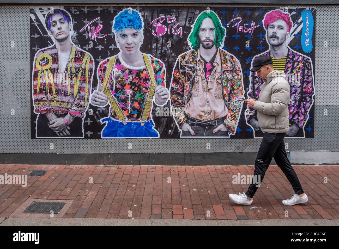 Brighton, December 17th 2021 A man walking past some great street art