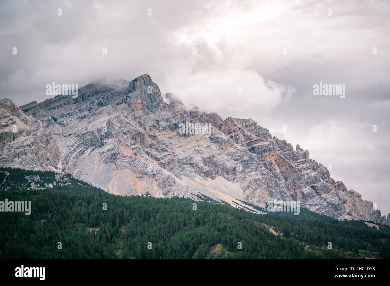 clouds over the mountains in the dolomites Stock Photo - Alamy