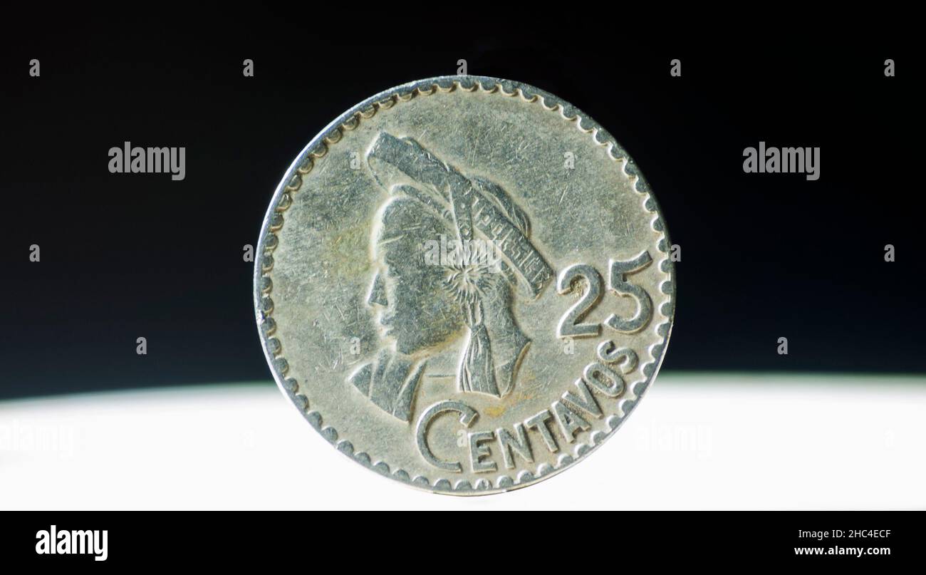Metal mondea with a value of twenty-five Quetzal cents, minted in the year 1970. Central America. Stock Photo