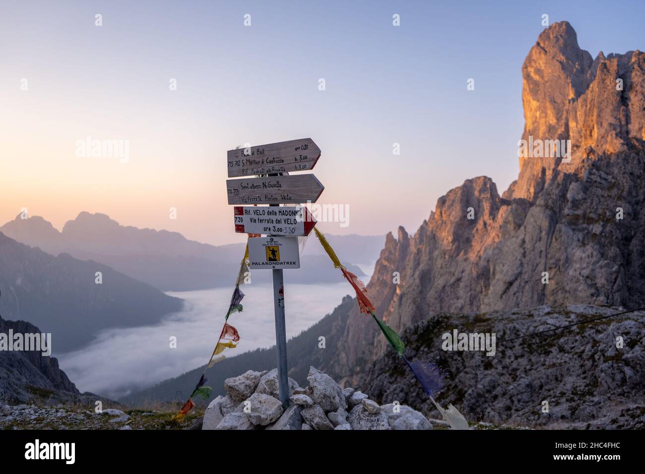signpost in pale di san martino in the dolomites on a sunrise in the mountains Stock Photo