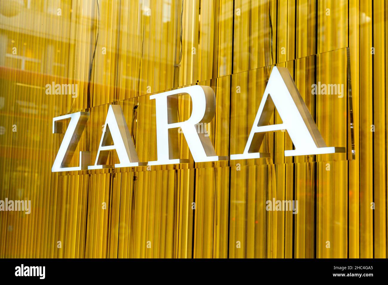 Logo of high street fashion retailer Zara in the store display window, Oxford Street, London, UK Stock Photo