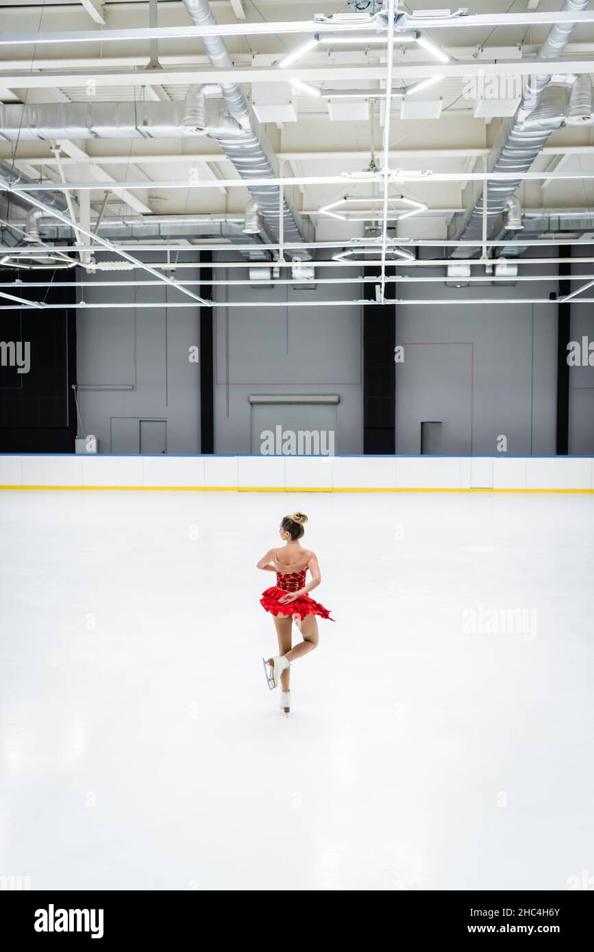 full length of young figure skater in professional ice arena Stock Photo Alamy