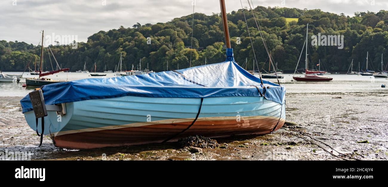 Beached sailing boat at low tide on the River Dart near Dittisham, South Devon, United Kingdom Stock Photo