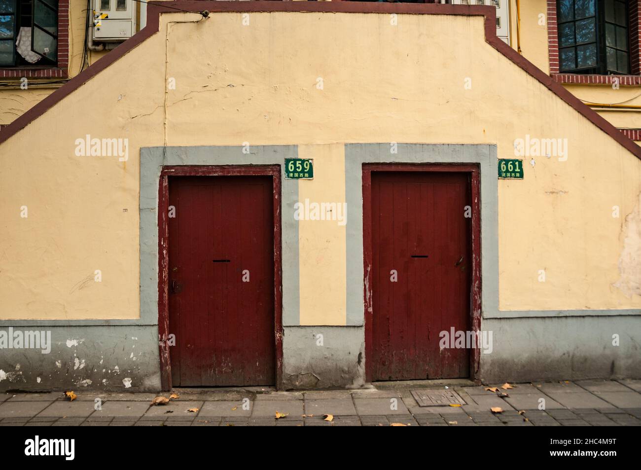 Matching doors on Jianguo Xilu in the Former French Concession, Shanghai, China. Stock Photo
