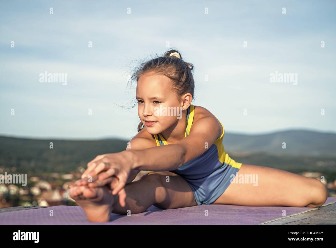 Great progress. health and fitness. gymnastics. happy teen girl on sky  background. kid has flexible body. child in sport clothes training. concept  of Stock Photo - Alamy