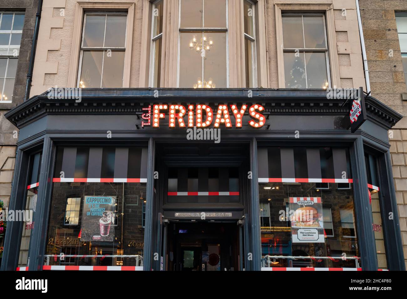 Edinburgh, Scotland- Nov 21, 2021:  The sign for TGI Fridays restaurant in Edinburgh. Stock Photo