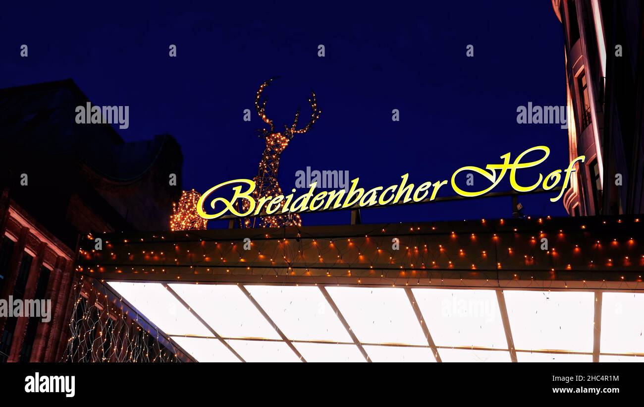 Entrance roof of the long-established hotel 'Breidenbacher Hof' on Königsallee in Düsseldorf/Germany with Christmas illumination. Stock Photo