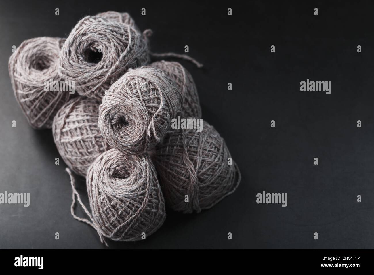 Light brown yarn made of natural sheep wool. Needlework Stock Photo