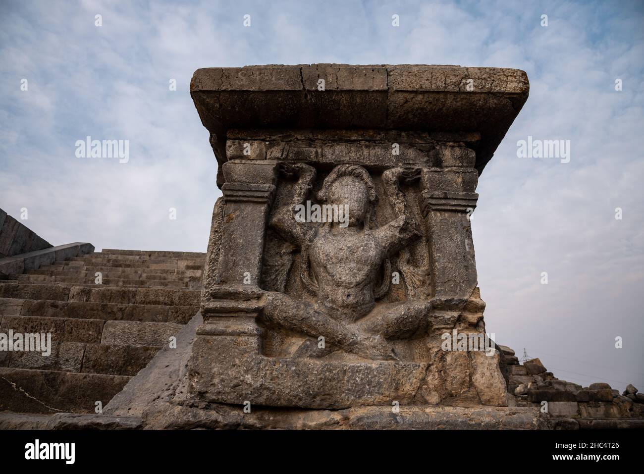 A view of carvings at the stairs of remains of Parihaspora Temple.Parihaspora is a small town 22 kilometers northwest of Srinagar, Kashmir . It was built on a plateau above the Jhelum River. It was built by Lalitaditya Muktapida (695-731) and served as the capital of Kashmir during his reign. Kalhana mentions the construction of the city in his Book 4 cantos 194-204. Lalitaditya according to Kalhana built his residence and four temples in this area. The temples included one for Vishnu where according to Kalhana the emperor used 84,000 tolas of gold to make the image of Vishnu. In another temp Stock Photo