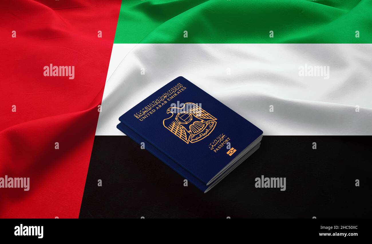 Passports of United Arab Emirates on the top of an flag of emirates Stock Photo