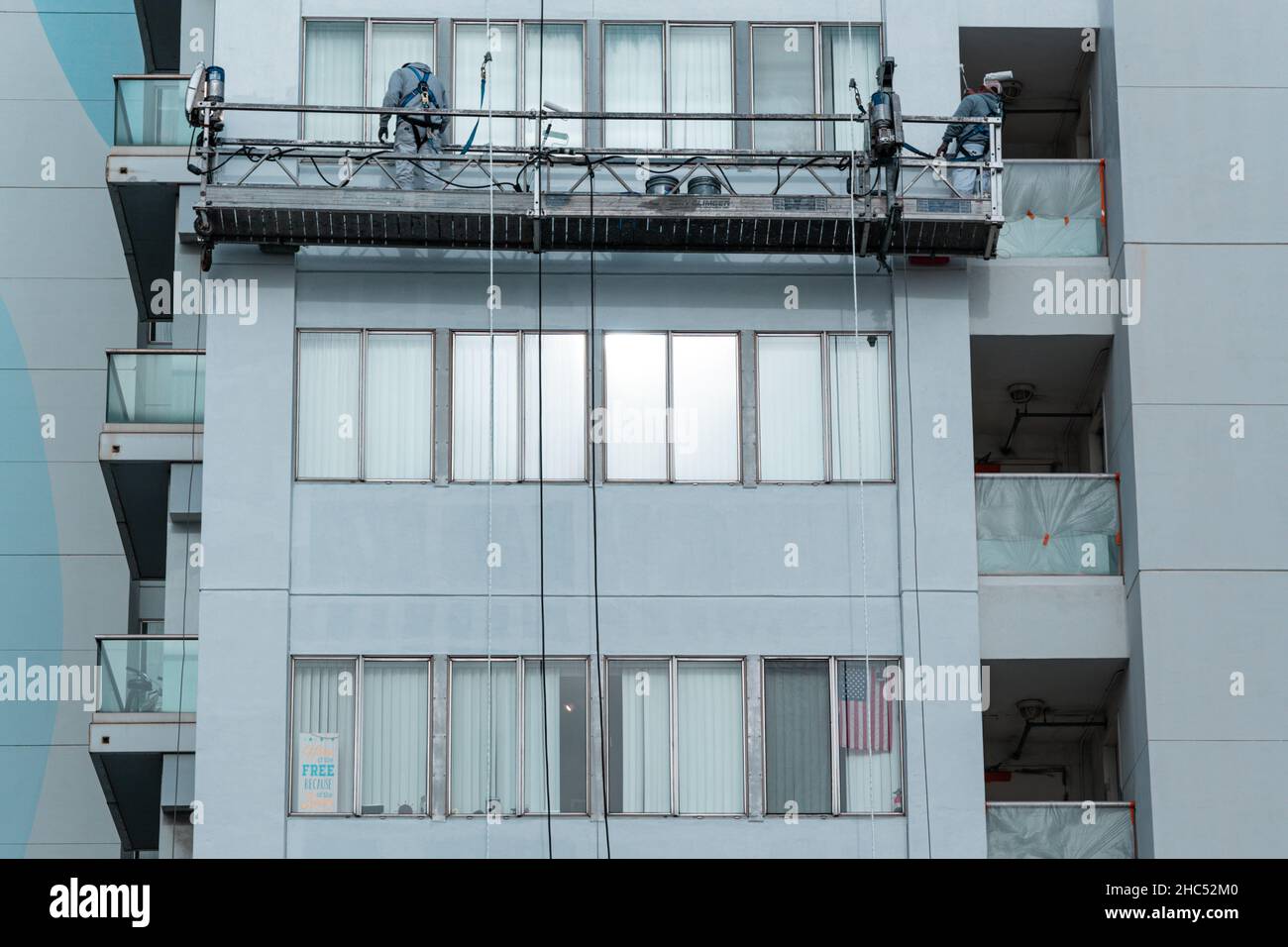 Two people cleaning the windows of a building. Santa Monica, US Stock ...