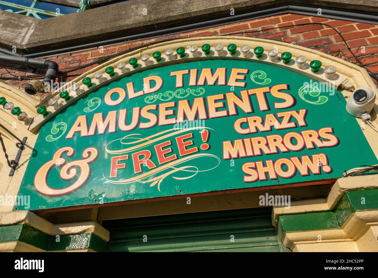 Colourful Old Time Amusements entrance sign the seafront on Brighton beach, Brighton, East Sussex, UK. Stock Photo