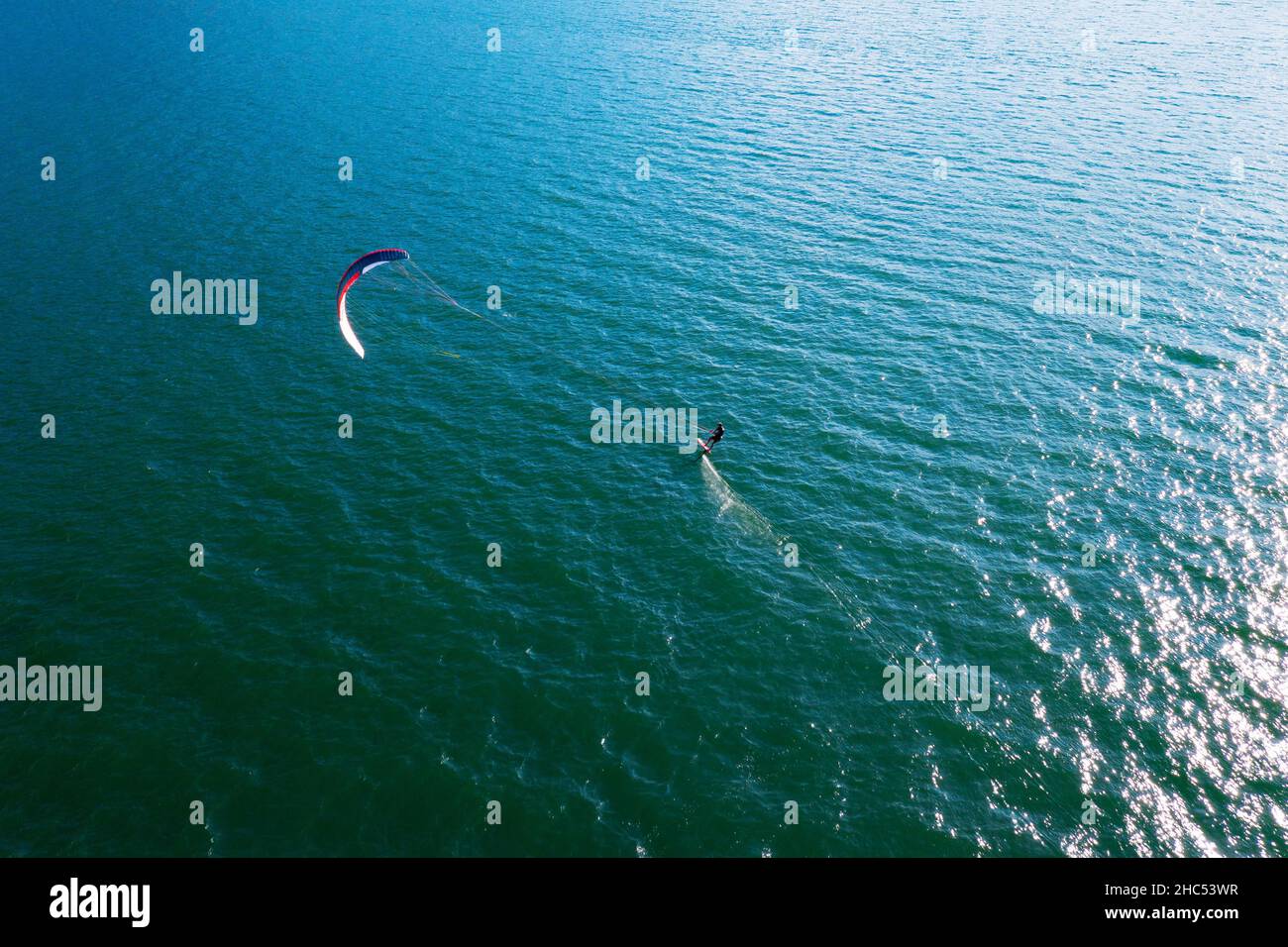 kitesurfer in action, aerial view Stock Photo