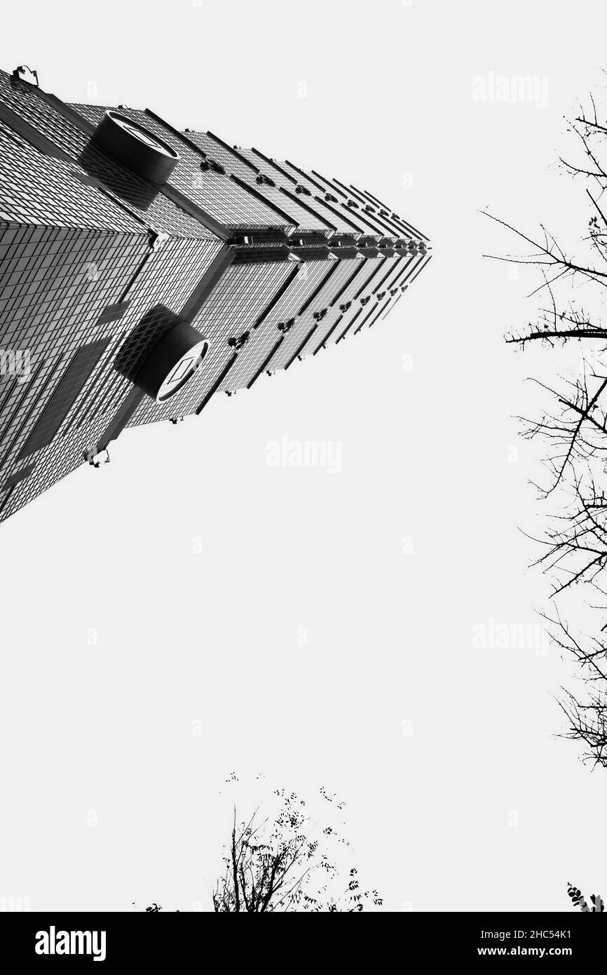 Vertical shot of the Taipei 101 from underneath in grayscale Stock Photo