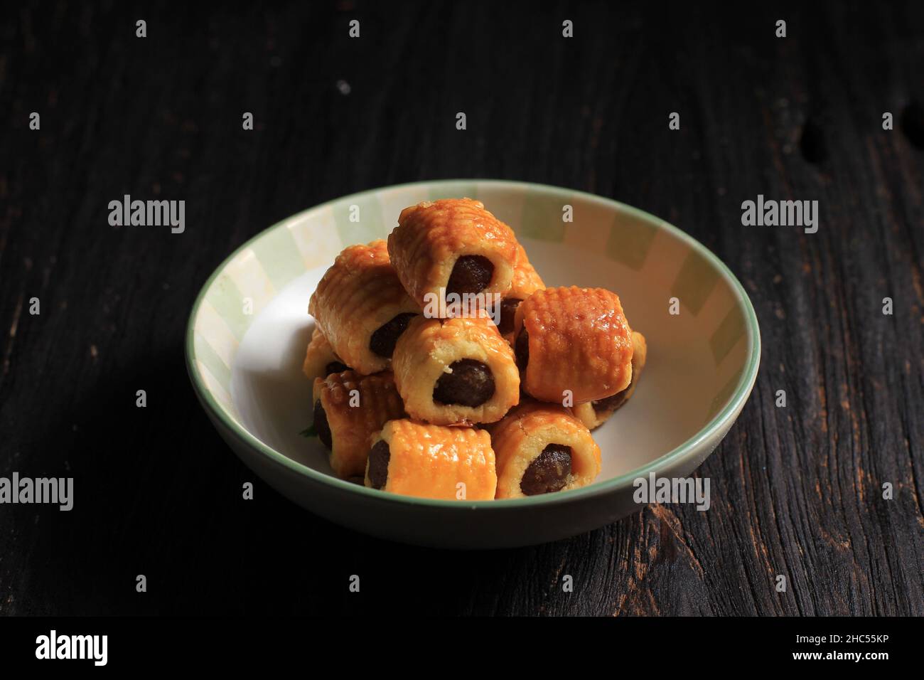 Nastar Gulung or Roll Pineapple Cookies or Pineapples Tarts. which is in the form of a rolls filled with pineapple jam. Popular is served during Eid a Stock Photo