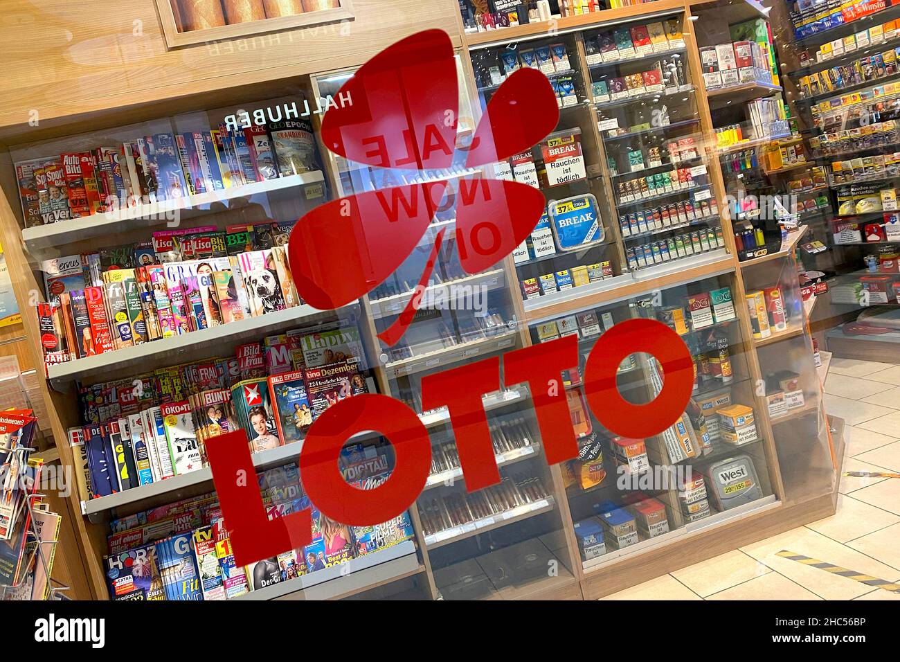 Lotto logo on the glass door, entrance door of a kiosk, lottery acceptance  point Stock Photo - Alamy
