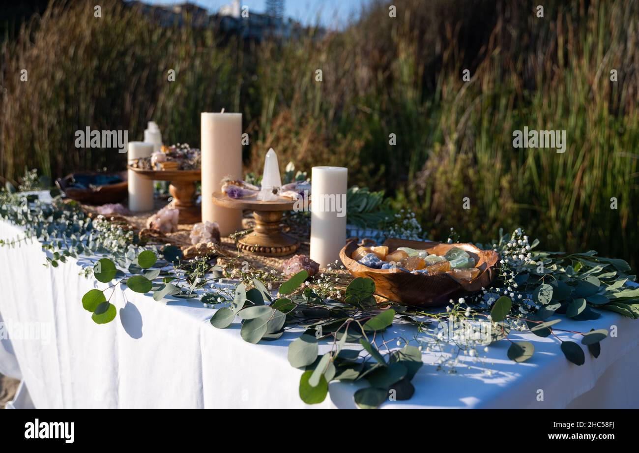 Beautifully decorated ceremonial table with mineral stones, smudging