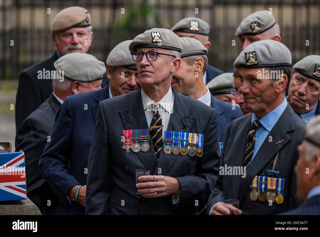 Veteran soldiers of Royal Scots Dragoon Guards wearing medals gather at an event, Royal Mile, Edinburgh, Scotland, UK Stock Photo