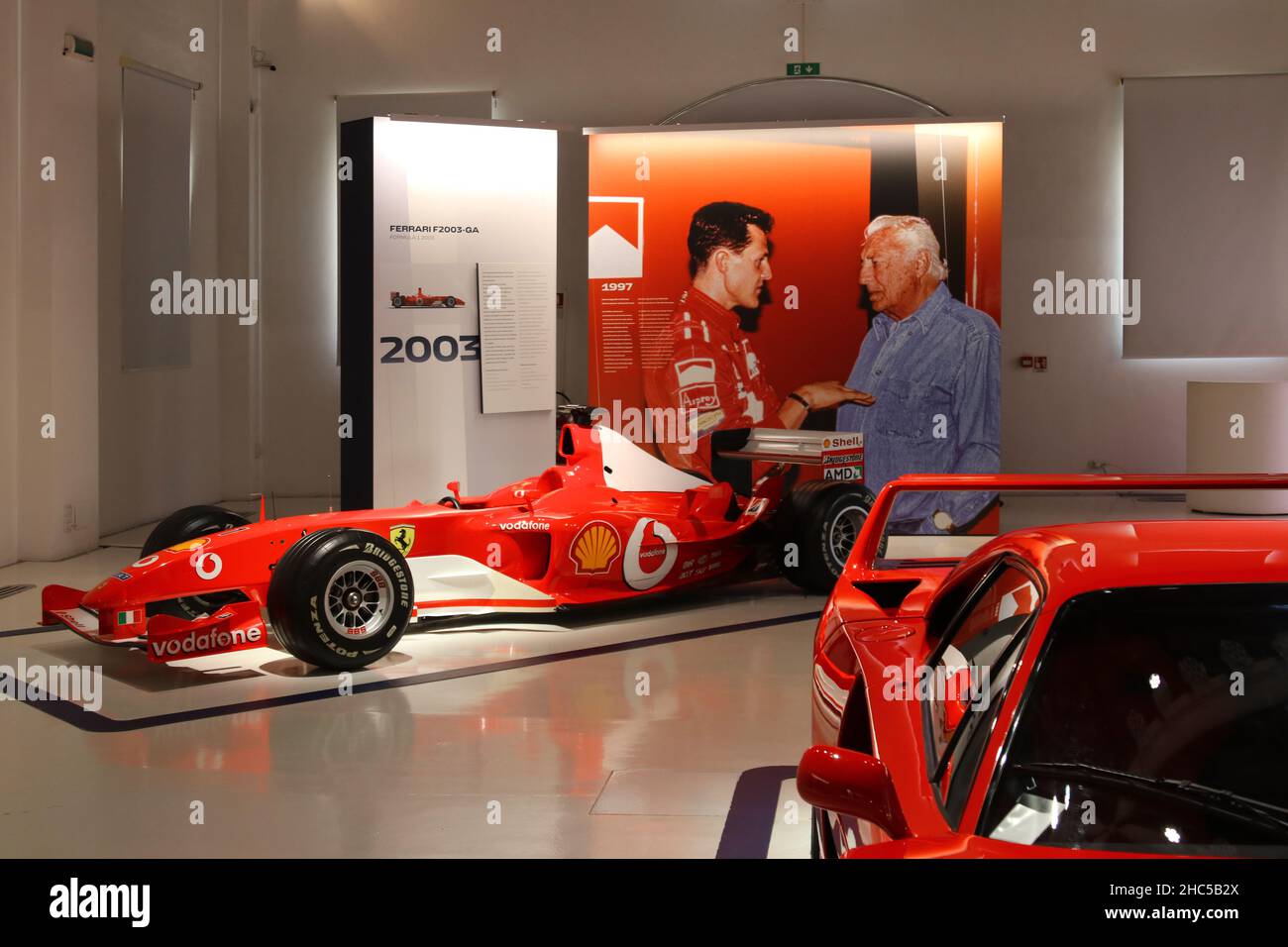 Modena, Italy, December 2021, MEF Ferrari Museum birth home of Enzo Ferrari,  Ferrari F2002 F1 of Michael Schumacher, year 2003, panel with images of G  Stock Photo - Alamy