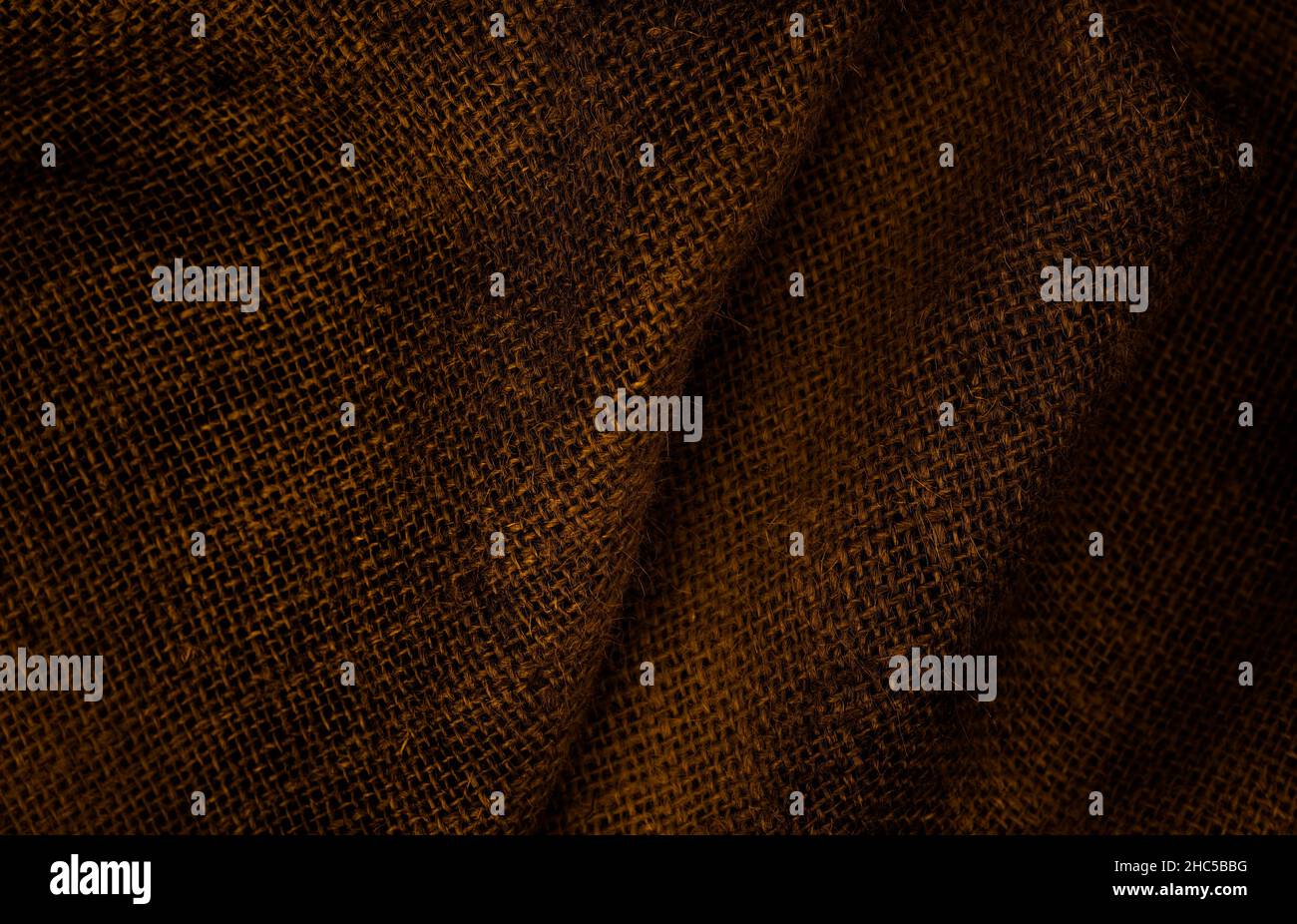 Twisted brown sackcloth texture background with selective focus Stock Photo