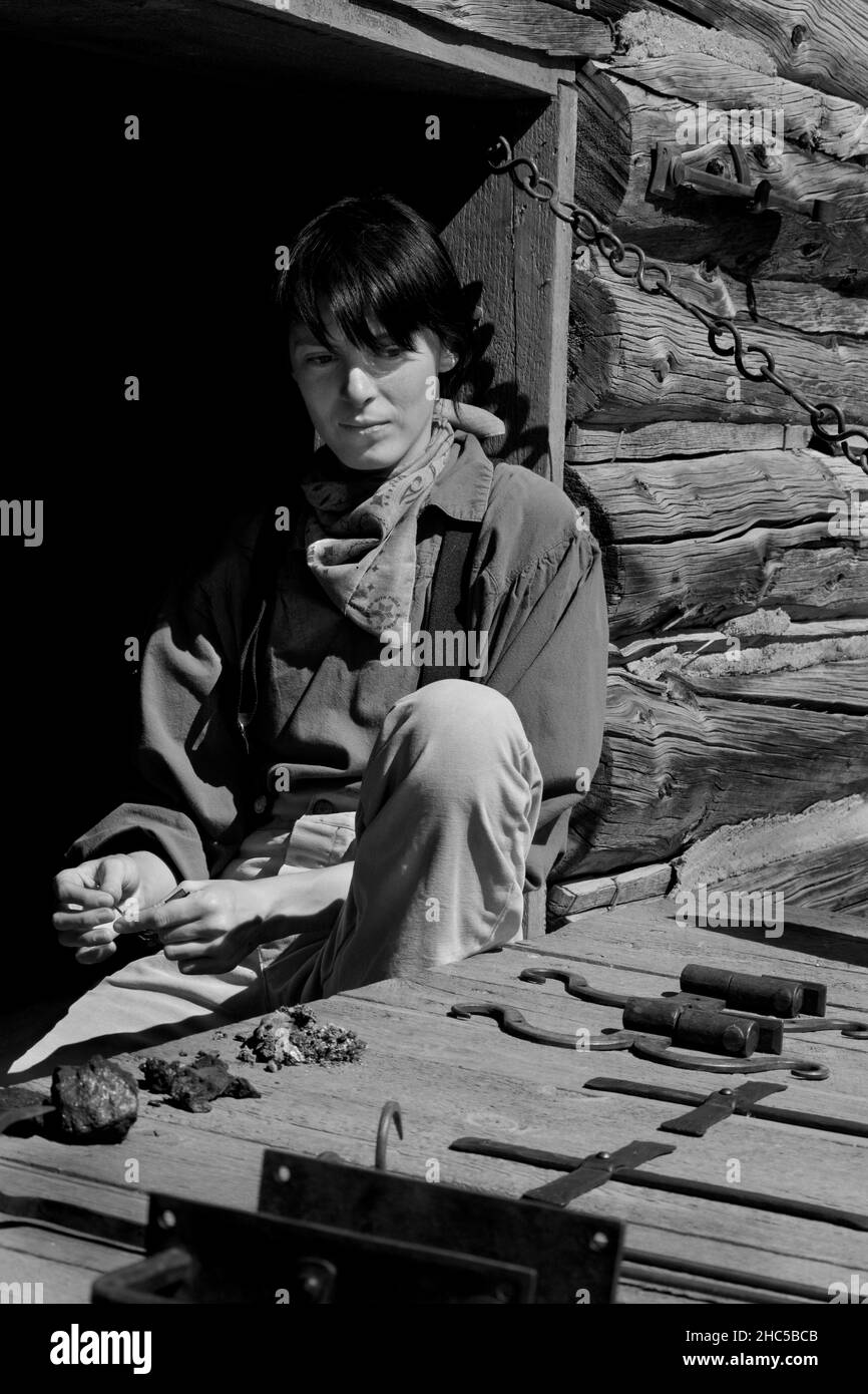 A young female blacksmith apprentice displays her work at El Rancho de las Golondrinas living history complex near Santa Fe, New Mexico. Stock Photo