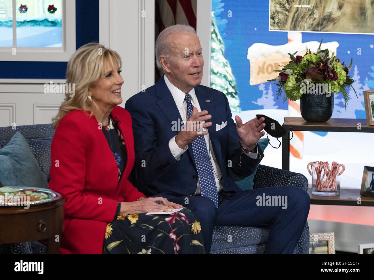 Washington, United States. 24th Dec, 2021. United States President Joe Biden and first lady Dr. Jill Biden speak to families from the South Court Auditorium, on the White House grounds in Washington, DC, as NORAD (North American Aerospace Defense Command) follows Santa's journey on Christmas Eve, Friday, December 24, 2021. Photo by Ron Sachs/UPI Credit: UPI/Alamy Live News Stock Photo