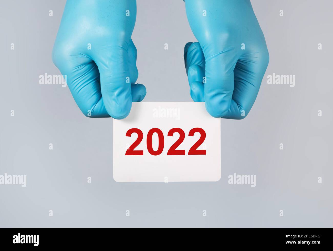 2022 new year, medical concept in hands over background. Stock Photo