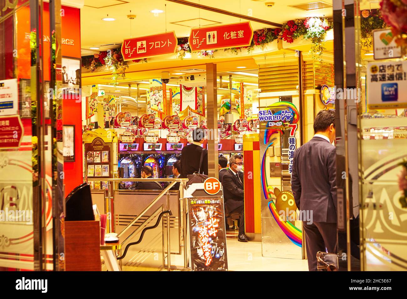 Tokyo, Japan, April 2018. Games Hall in Tokyo city, area of Ueno station Japan. Adult Japanese men spend a lot of time   with slot machines . Stock Photo