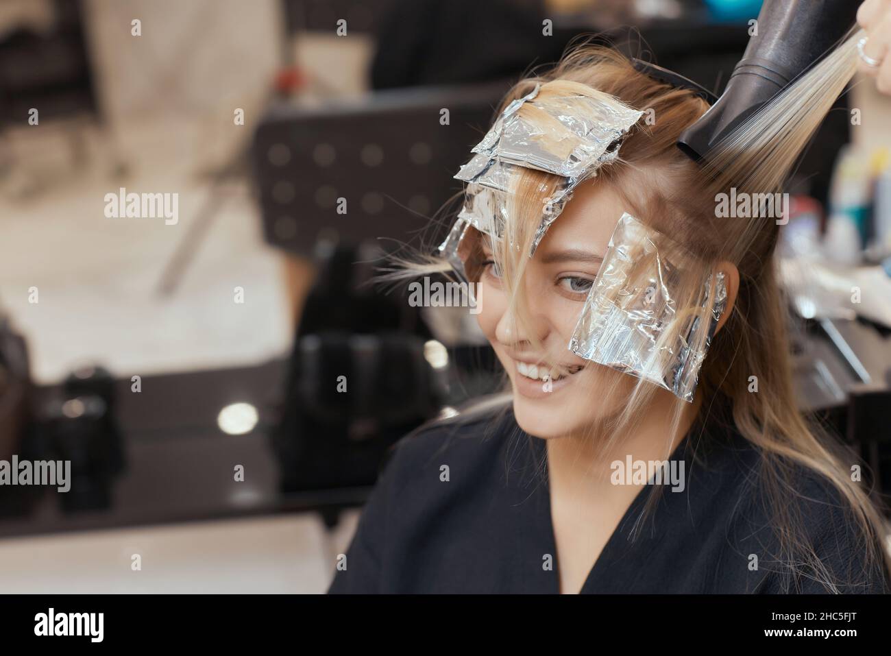 Premium Photo  Foil on models hair. trendy hair bleaching using shatush  technique. look from behind