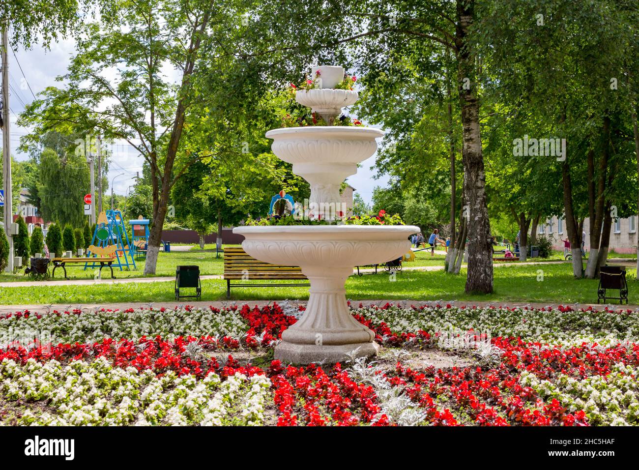 Decorative fountain with flowers in the park Stock Photo - Alamy